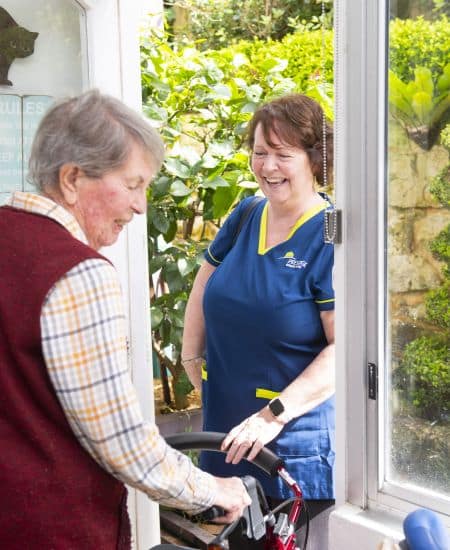 care partner visiting their client with a smile
