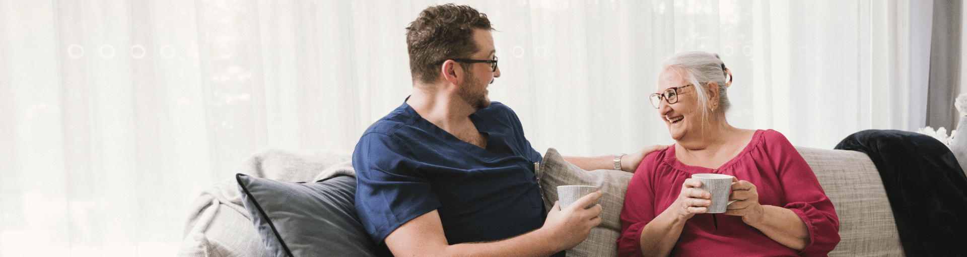 Prestige client having a cup of tea with carer