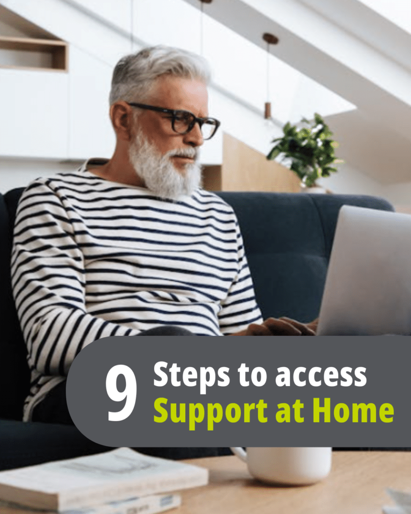 Man sitting on the couch looking at the steps to apply for Support at Home
